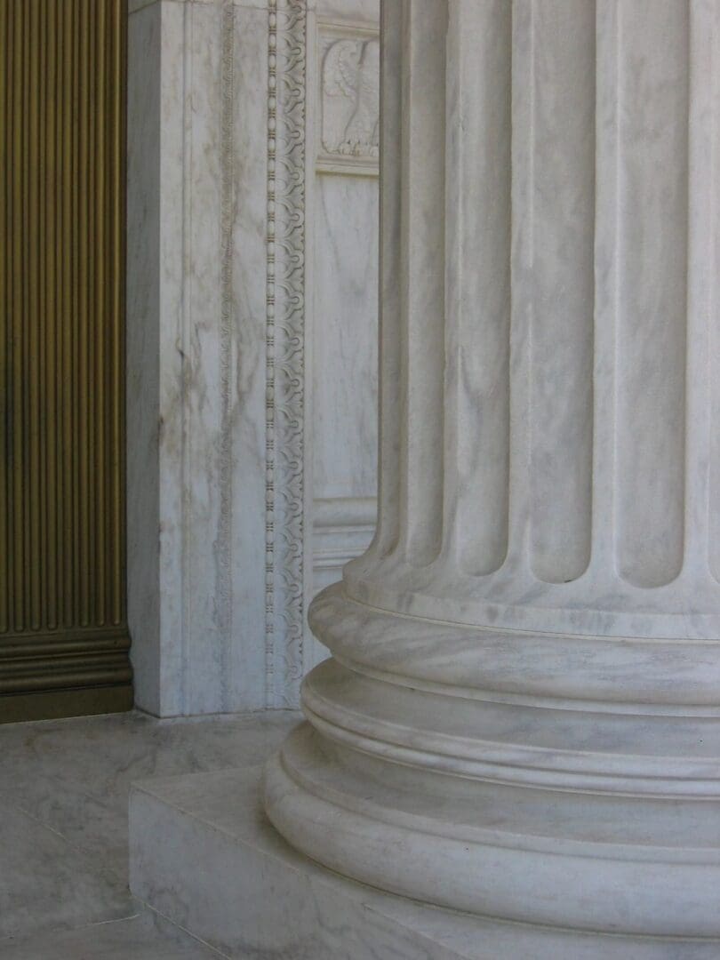 A close up of the pillars in front of a door